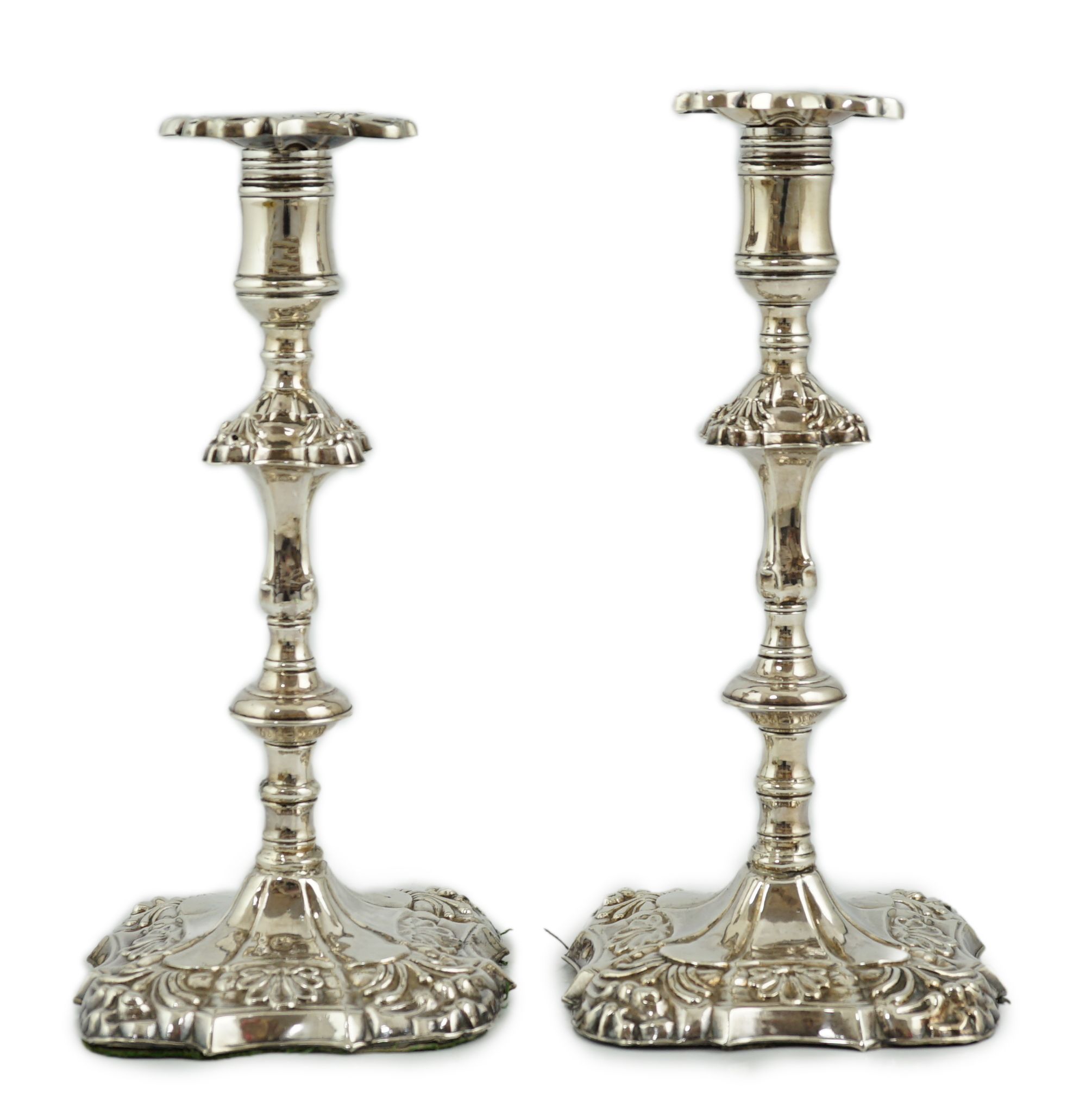 A pair of early George III silver candlesticks, by James Stamp & John Baker